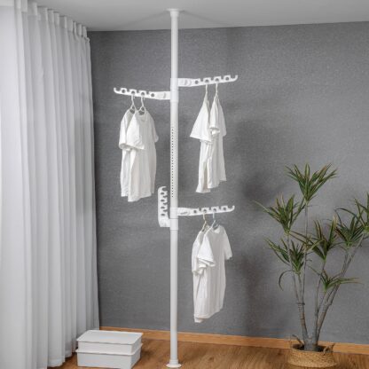 Extra Long Clothes Hanger With The Top Relying On The Ceiling And Nuclear Floor - Image 7